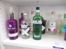 Shelf of part open gin bottles of spirits including Whitley Neill, Liverpool Gin, Monkey 47 etc