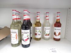 Shelf of Morin Syrups and Funkin Pro Cocktail Mixers