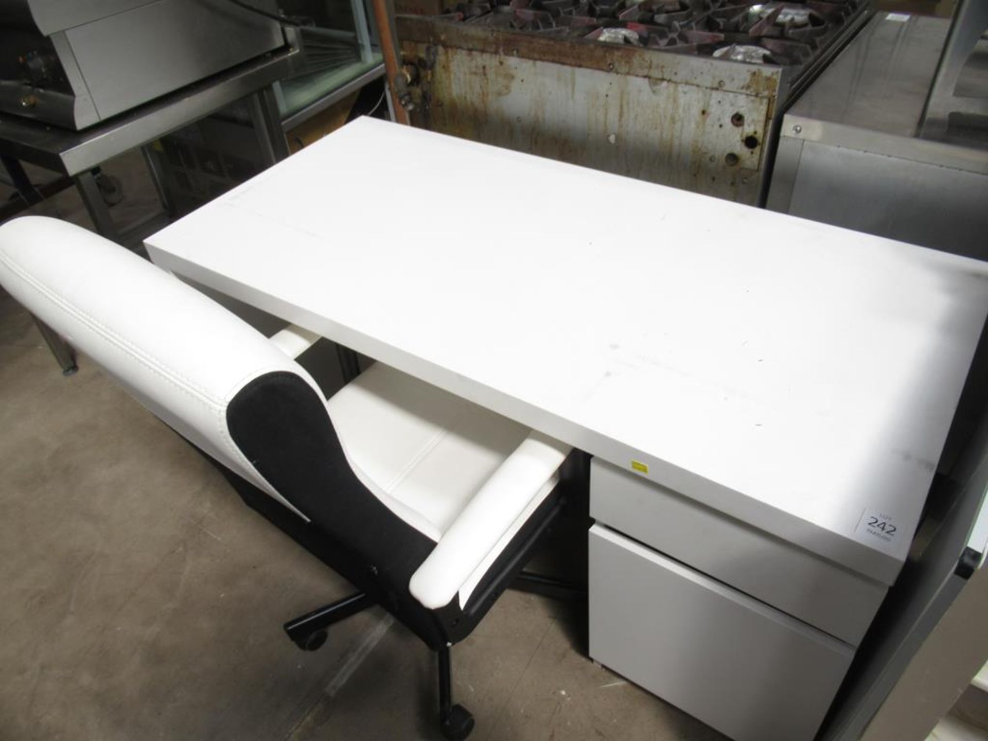 A White Wooden Desk with Operator Chair