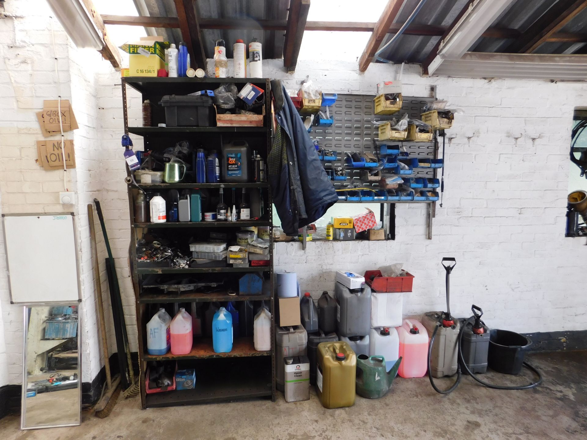 Shelving and contents & assortment of fluids (part filled) to wall