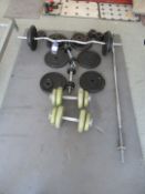 Quantity Loose Weight Lifting Bars and Plates on Mat