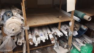 Assortment of various rolls of fabric, including off-cuts, to 4 x bays of wooden racking