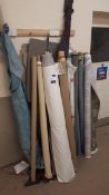 Assortment of fabric off-cuts, to wall and under table, including leather off-cuts