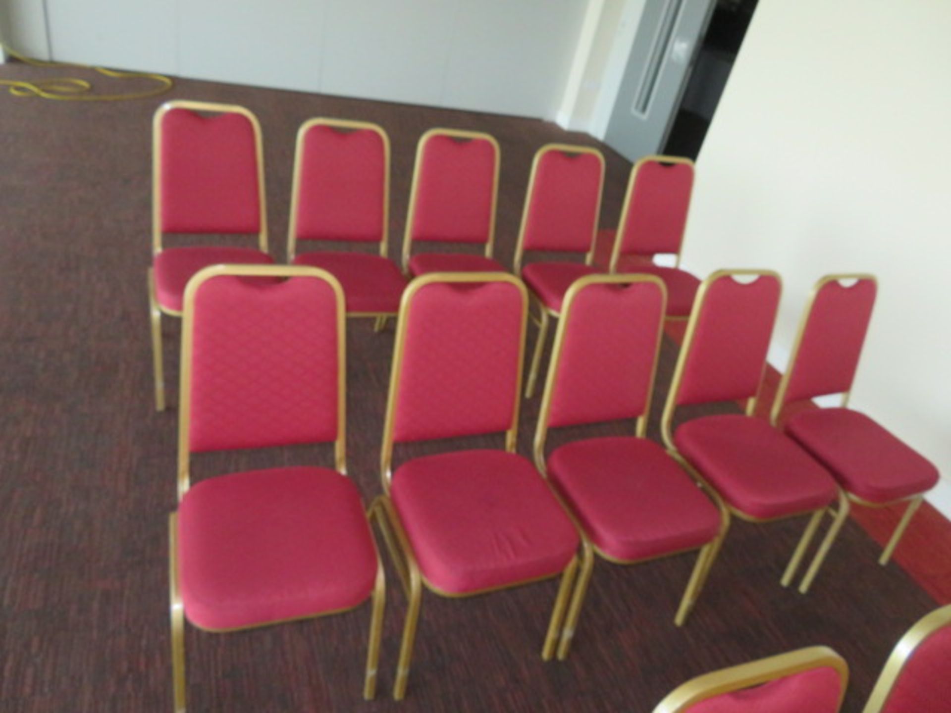 10 x STACKABLE RED CUSHIONED CHAIRS WITH GOLD OUTL