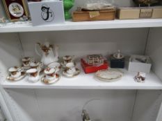 Two shelves of porcelain including Royal Crown Derby