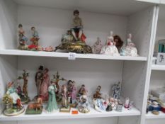 Two shelves of figures including Capodimonte etc