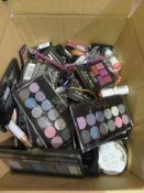 Circa. 200 items of various new make up acadamy make up to include: lipstick, glow beam highlighting