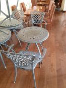 Ornate cast metal table with 2 Oxley's elbow chair