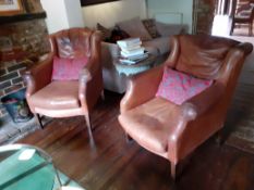 Pair of Tan leather upholstered armchairs