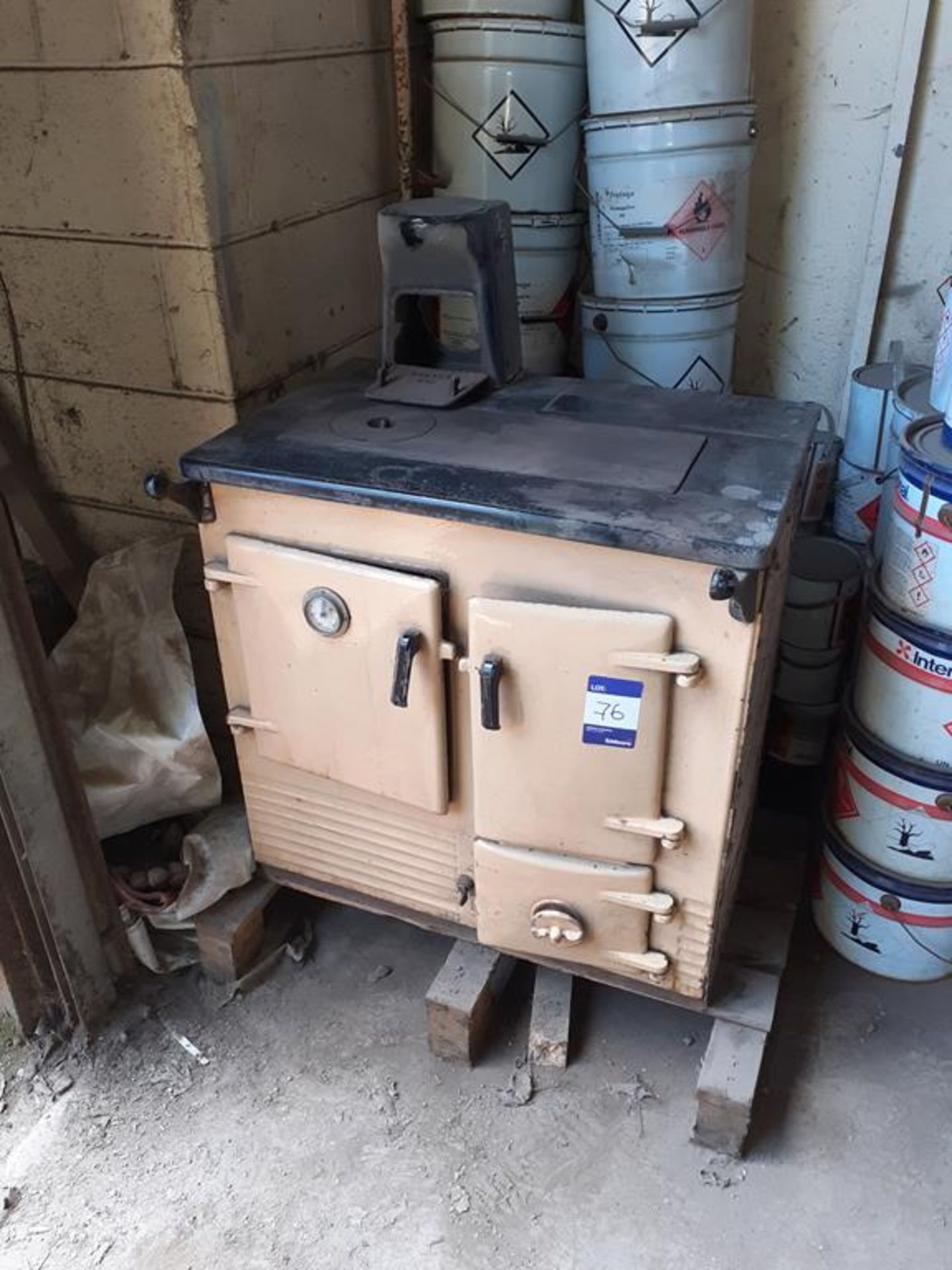 Cast iron single oven/hot plate solid fuel range circa 1976. This lot is Buyer to Remove.