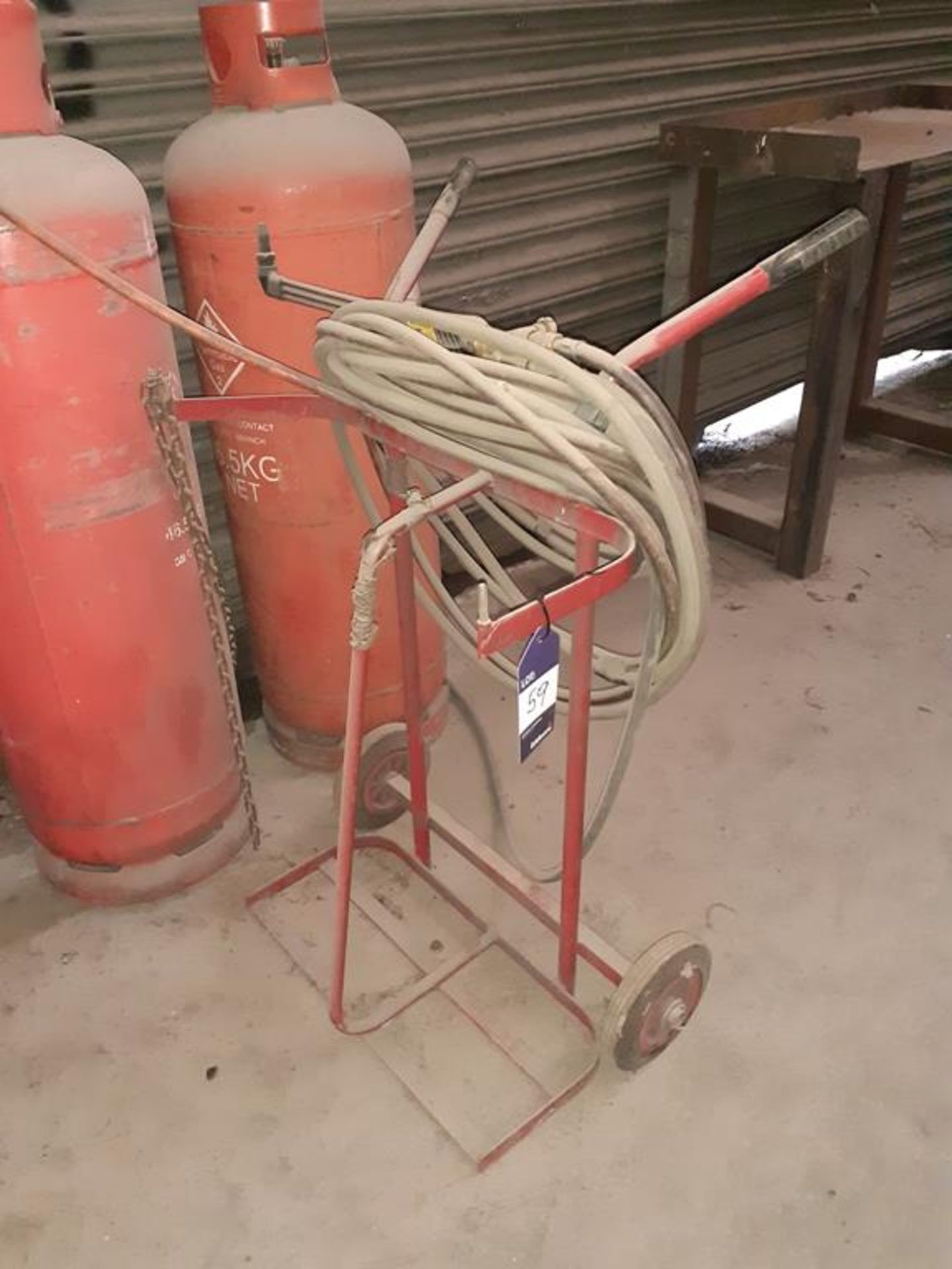 Twin gas bottle trolley with gas burner torch (note bottles not included). This lot is Buyer to Remo