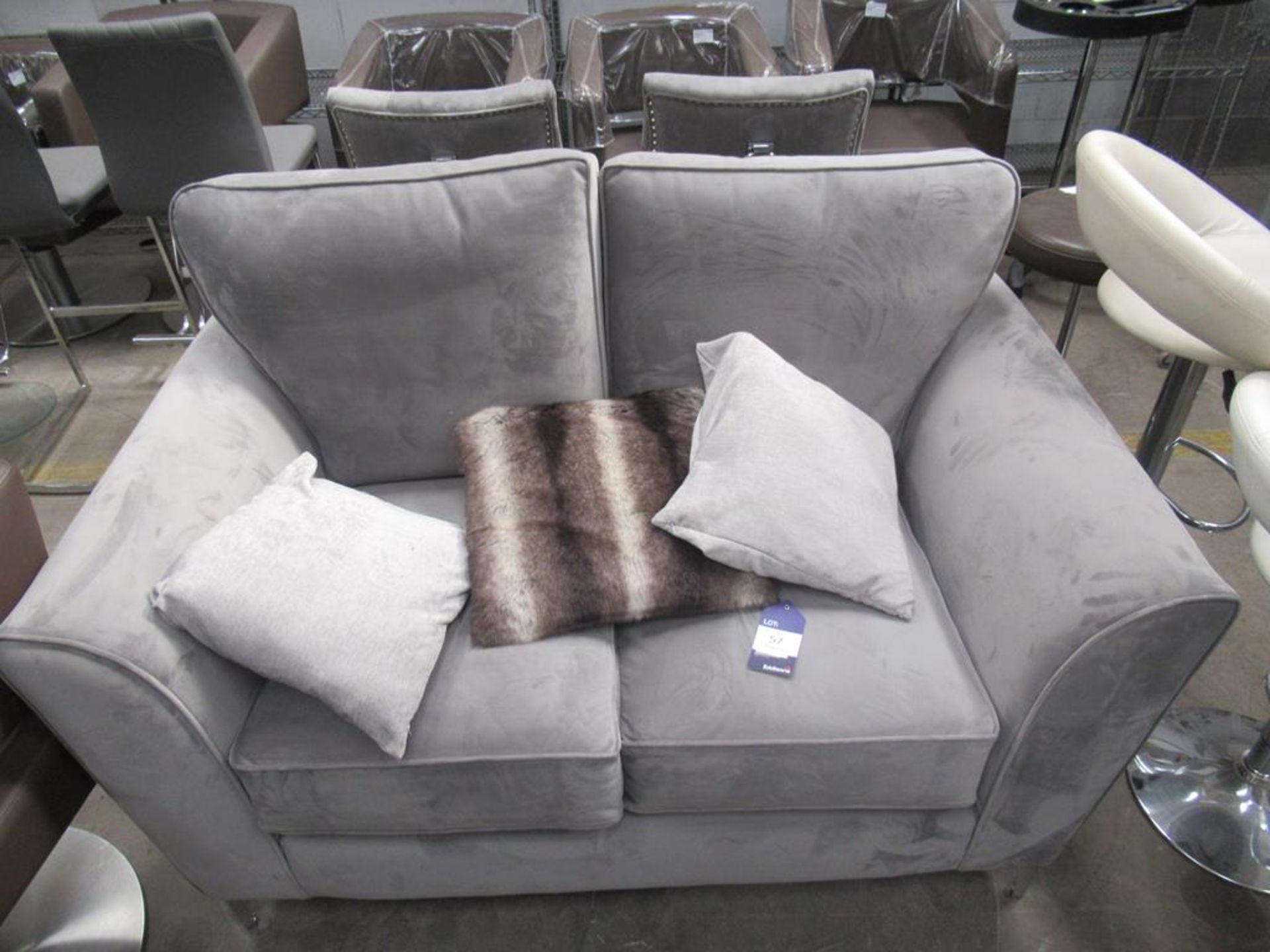 A grey suede effect two seater sofa