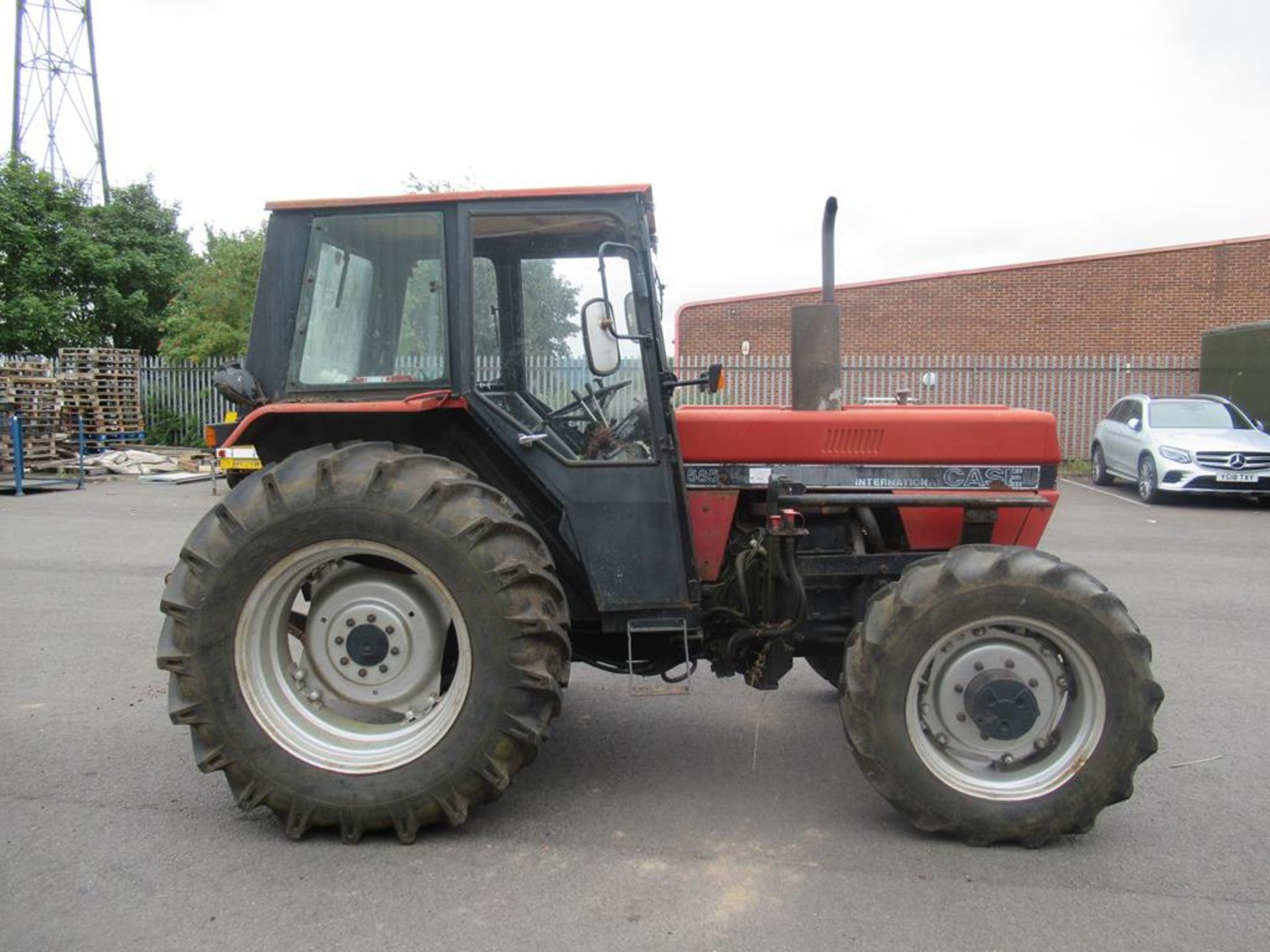 Case 585 MX255 tractor with loading arms and bucket