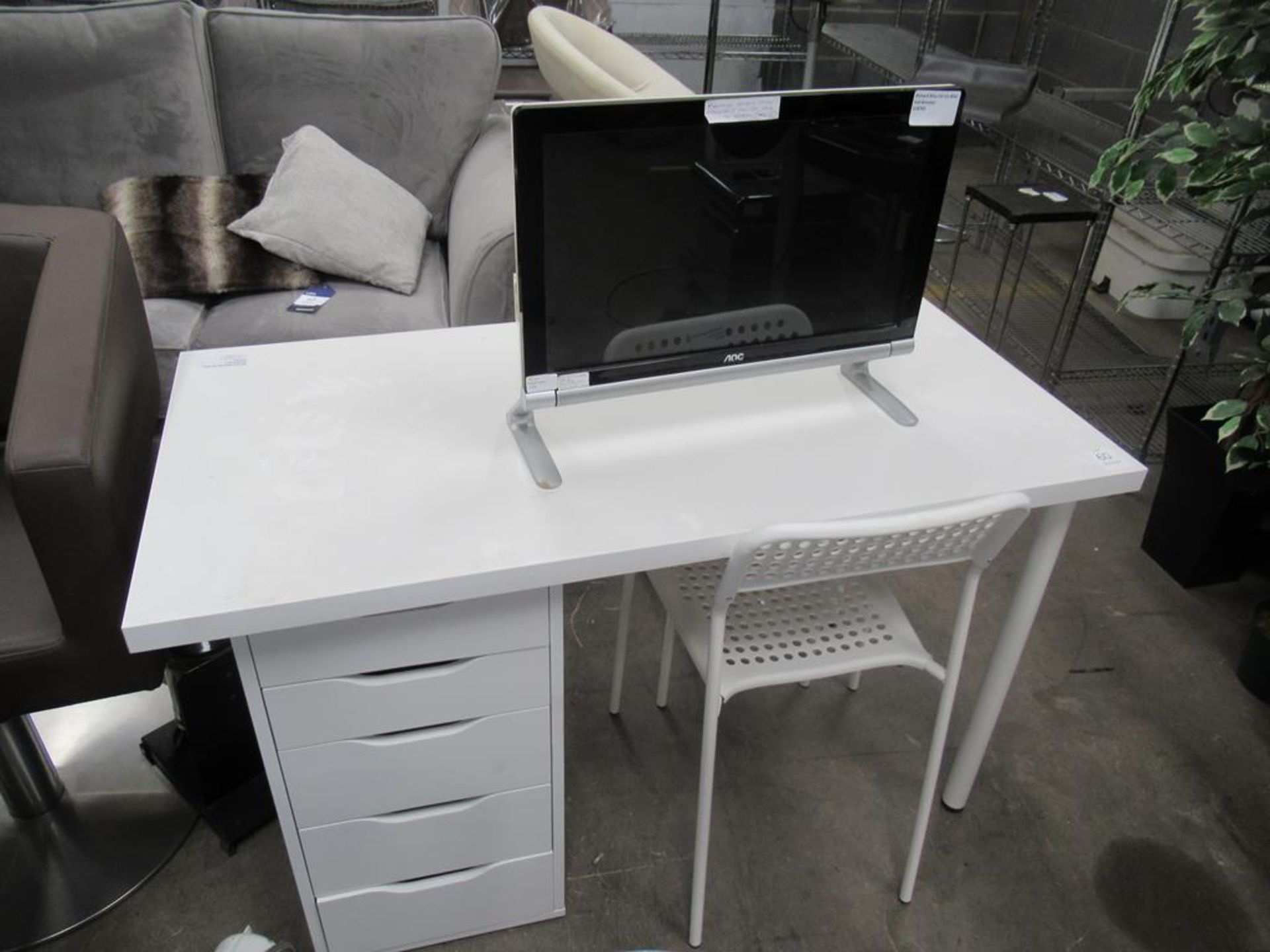 A white desk with 2 x chairs and AOC monitor