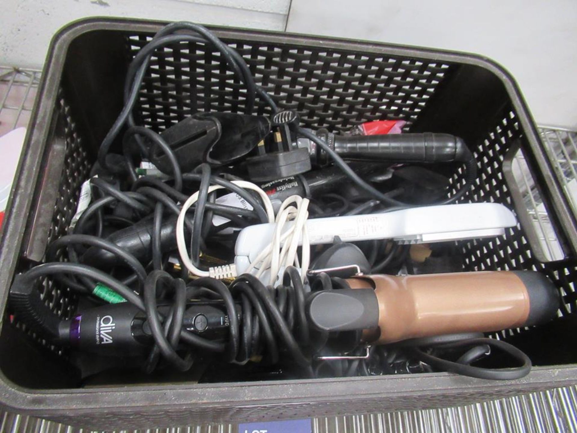 Basket of curling tongs and straighteners