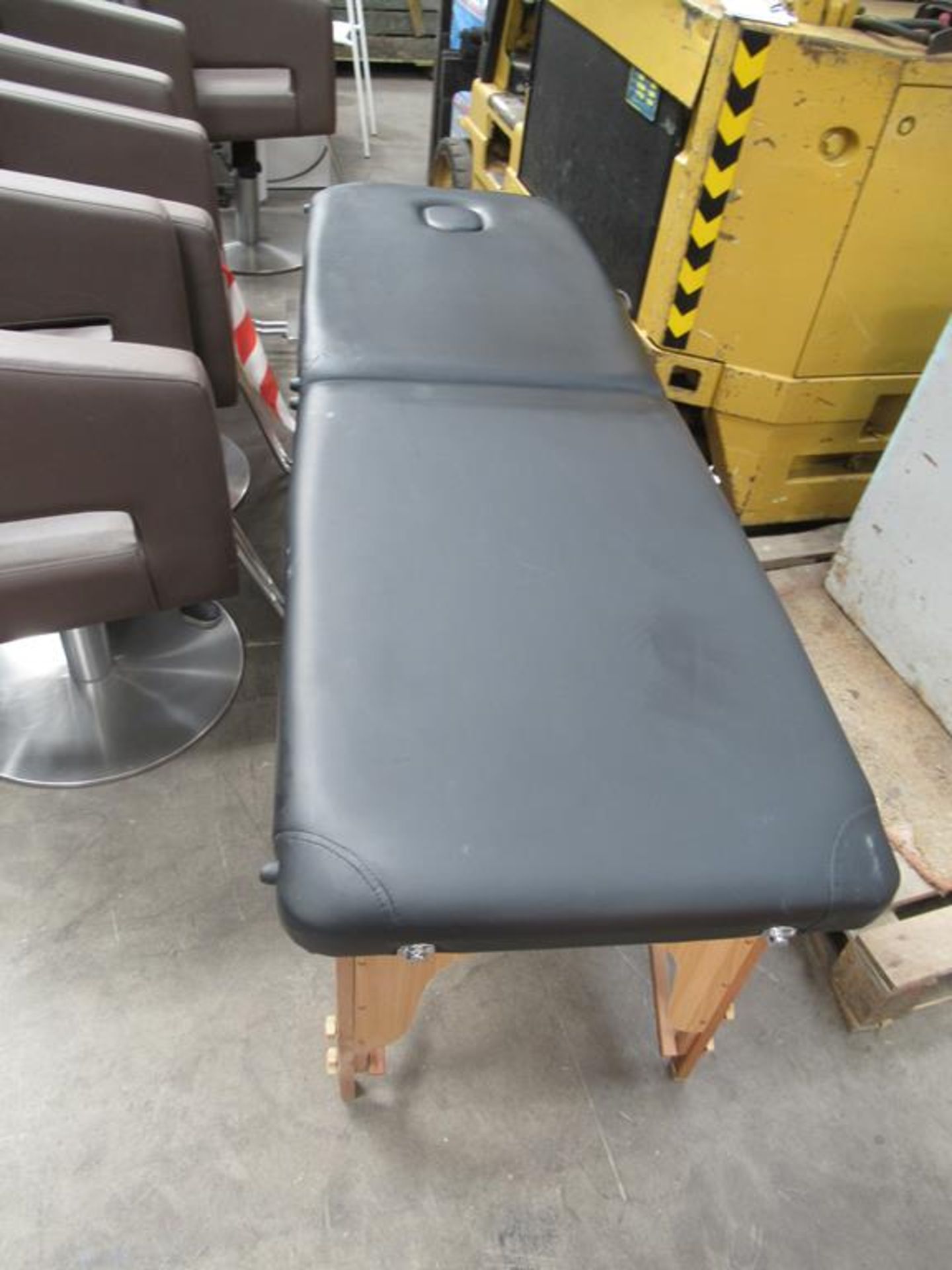 A leather effect fold out massage table