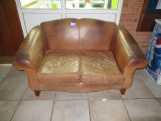 Distressed leather 2 seater settee - note damage to arm