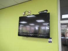 Technika wall mounted 31" colour TV - with remote