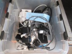 Box of assorted tech accessories including cables,
