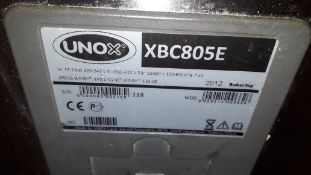 Unox XBC805E Combination Oven Assembly on Hot Cupb