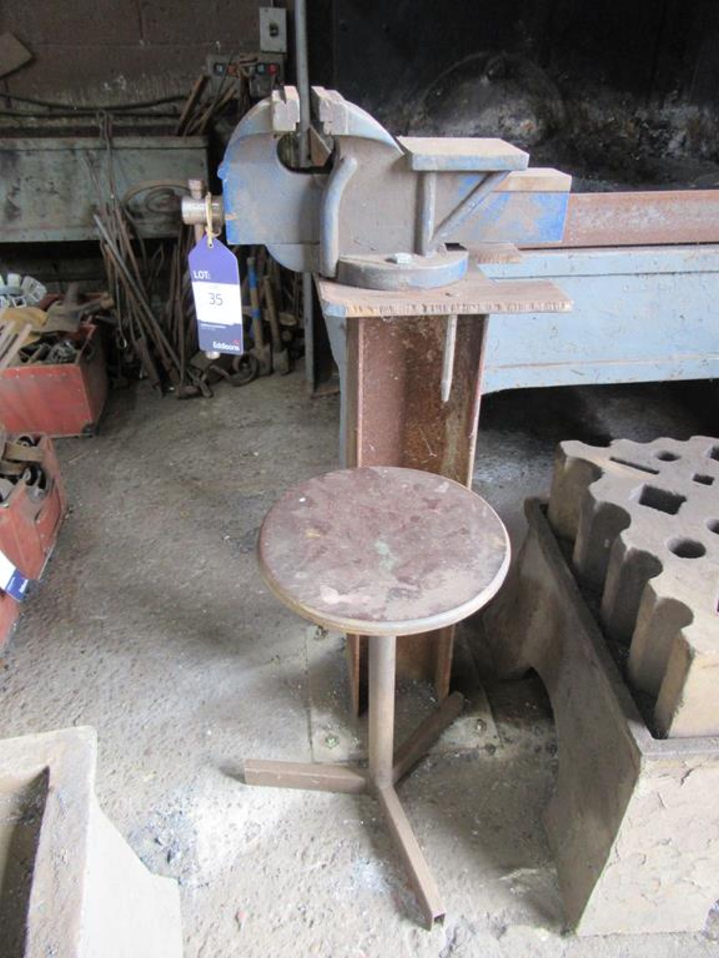 A stand mounted Sealy 6" vice and a fabricated stool