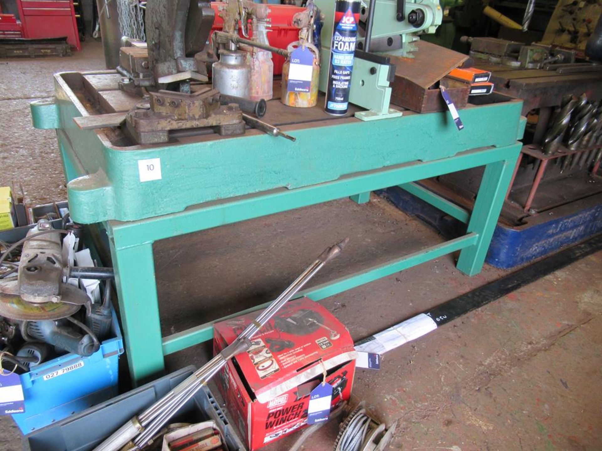 Steel workbench constructed from drill base on stands