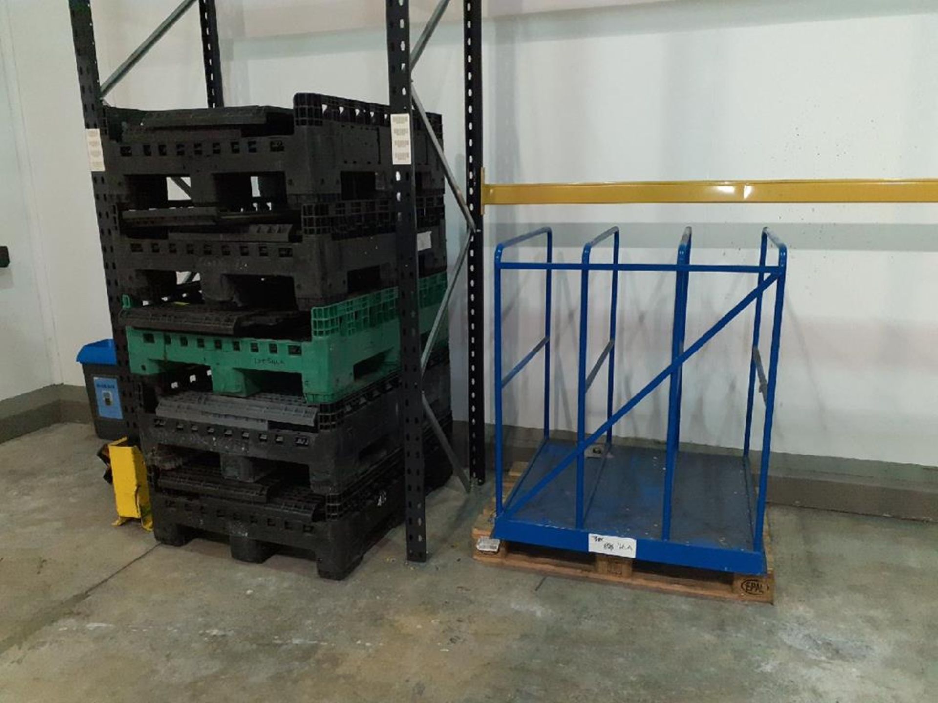 5x plastic pallets and a steel storage rack