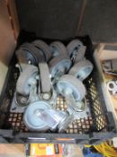 12 Rubber Wheeled Steerable Casters in plastic crate