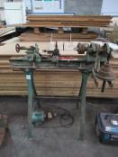 A wood turning lathe on stand