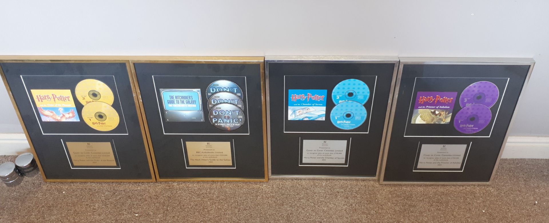 Assortment of framed memorabilia, including Harry