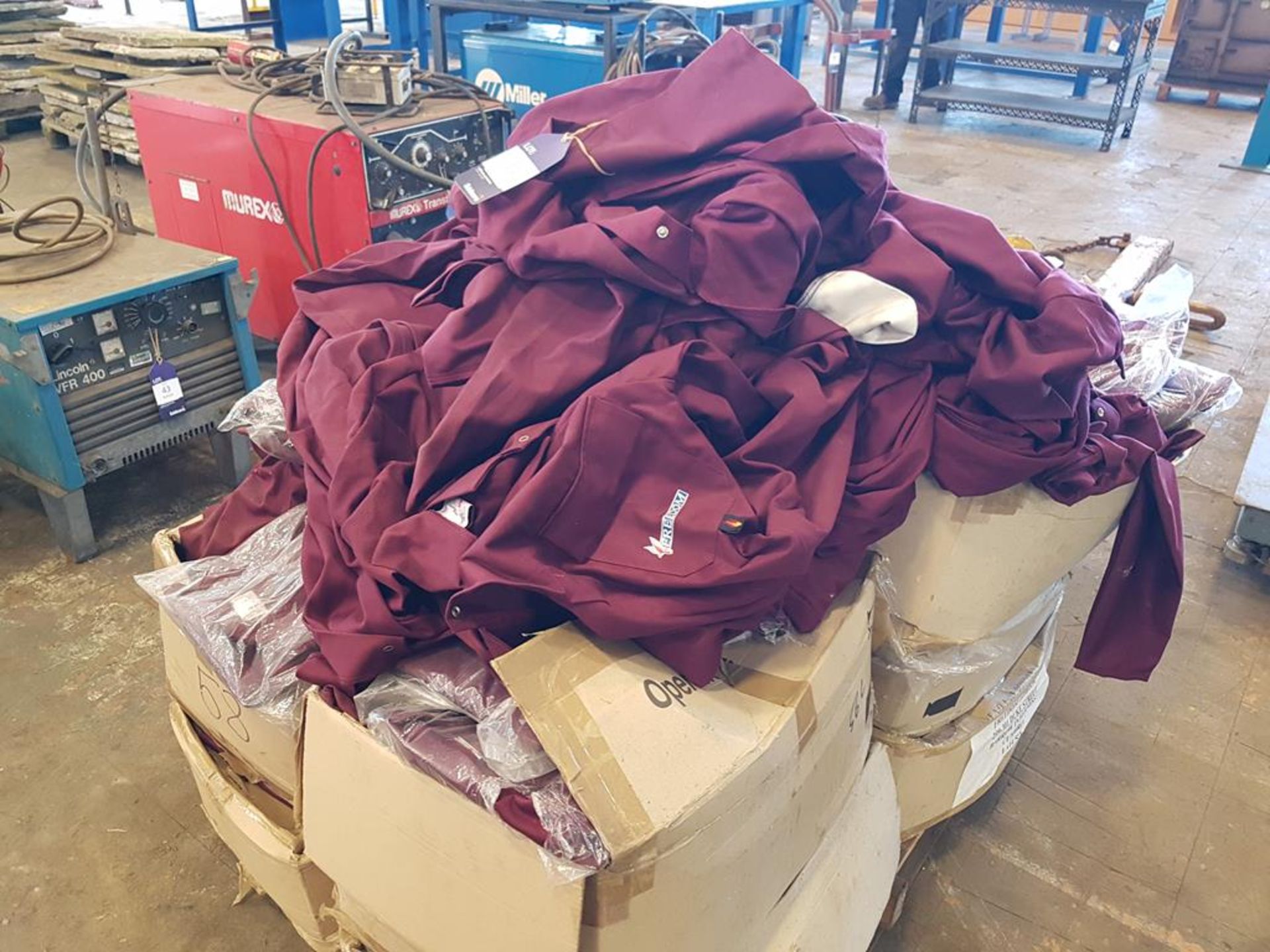 Pallet of Maroon Overalls Inc many in Polythene Wrappers