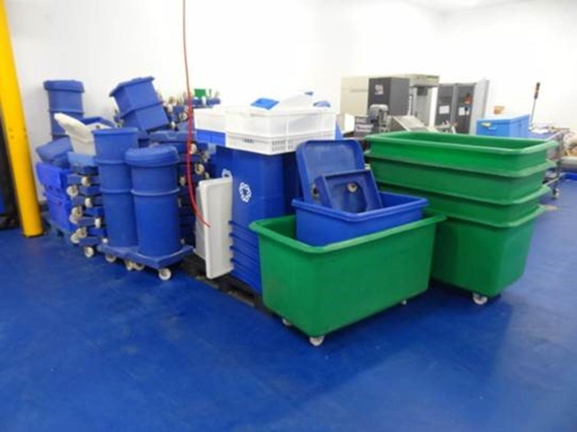 Assorted selection of plastic factory product bins, tubs, trolleys and dollys