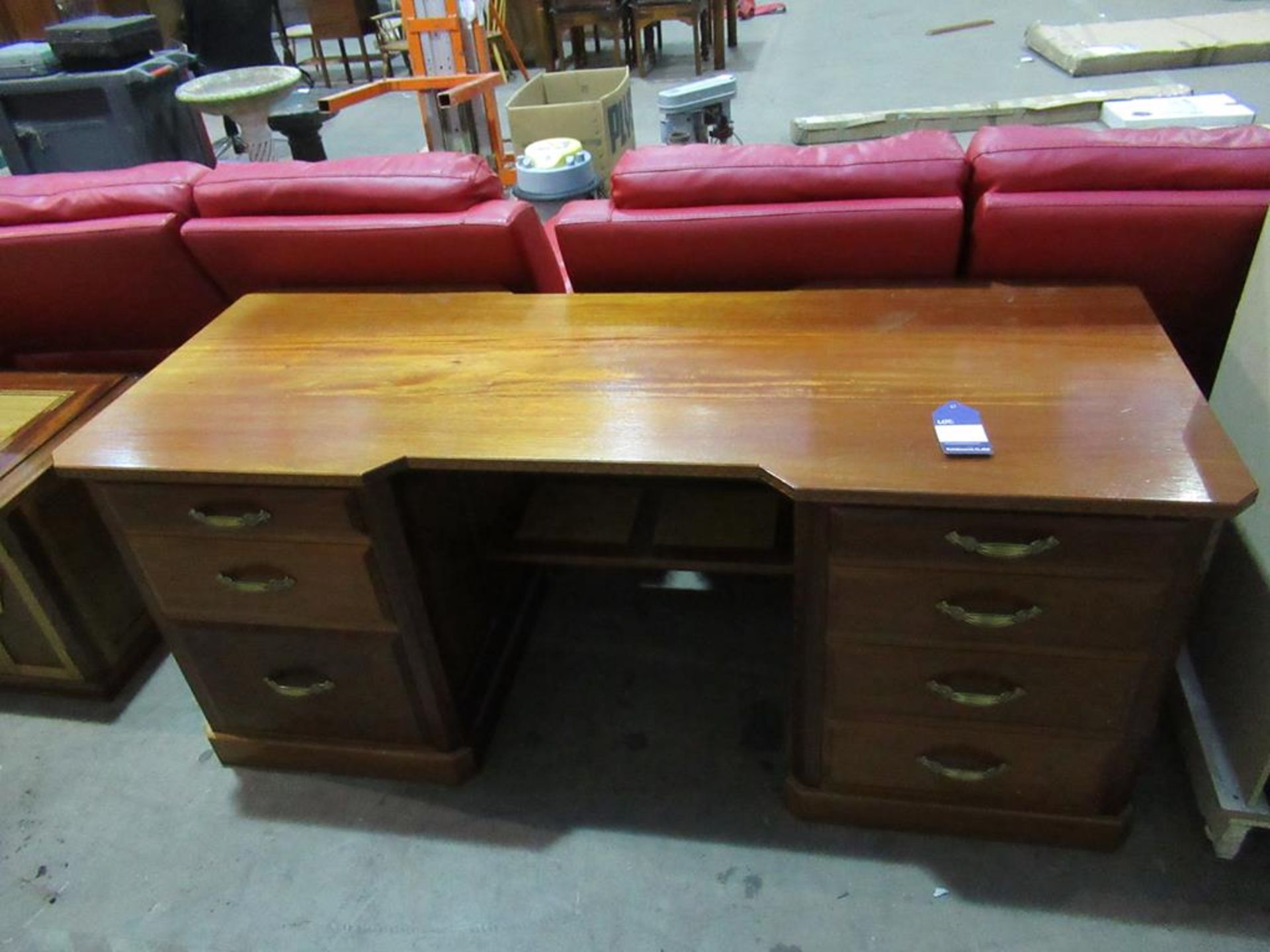 A large wooden twin pedestal desk