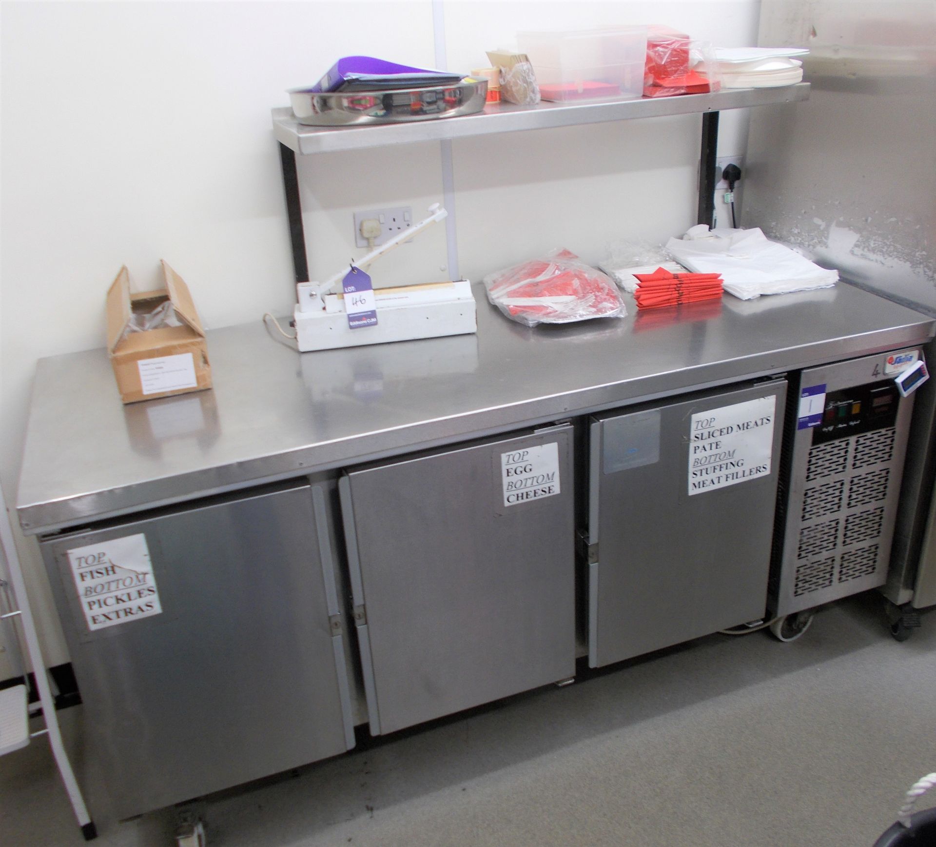 Sadia Refrigeration stainless steel worktop with 3 door undercounter chiller, and overhead stainless