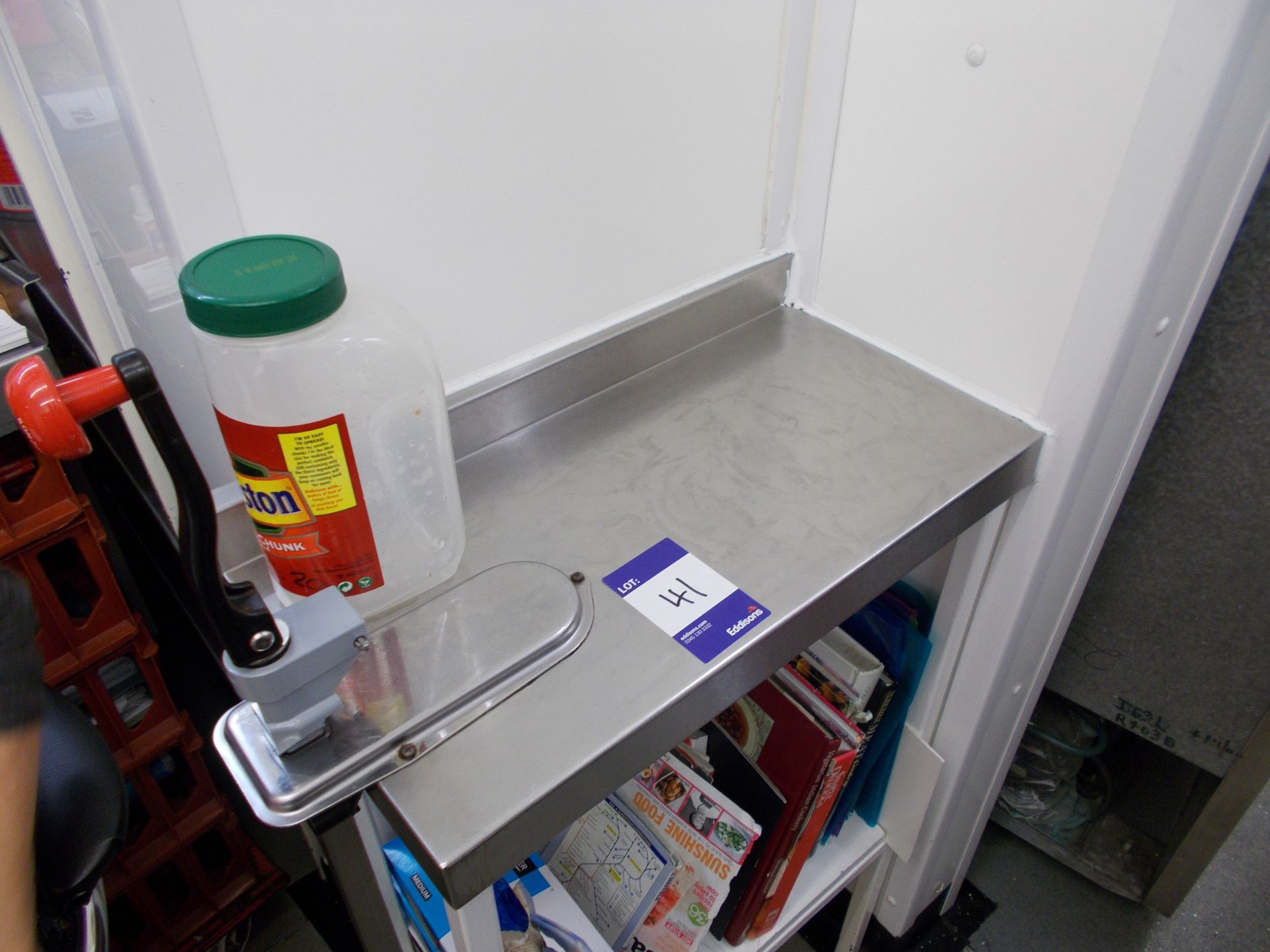 Stainless steel preparation table with can opener. *Please note, it is the purchasers responsibility