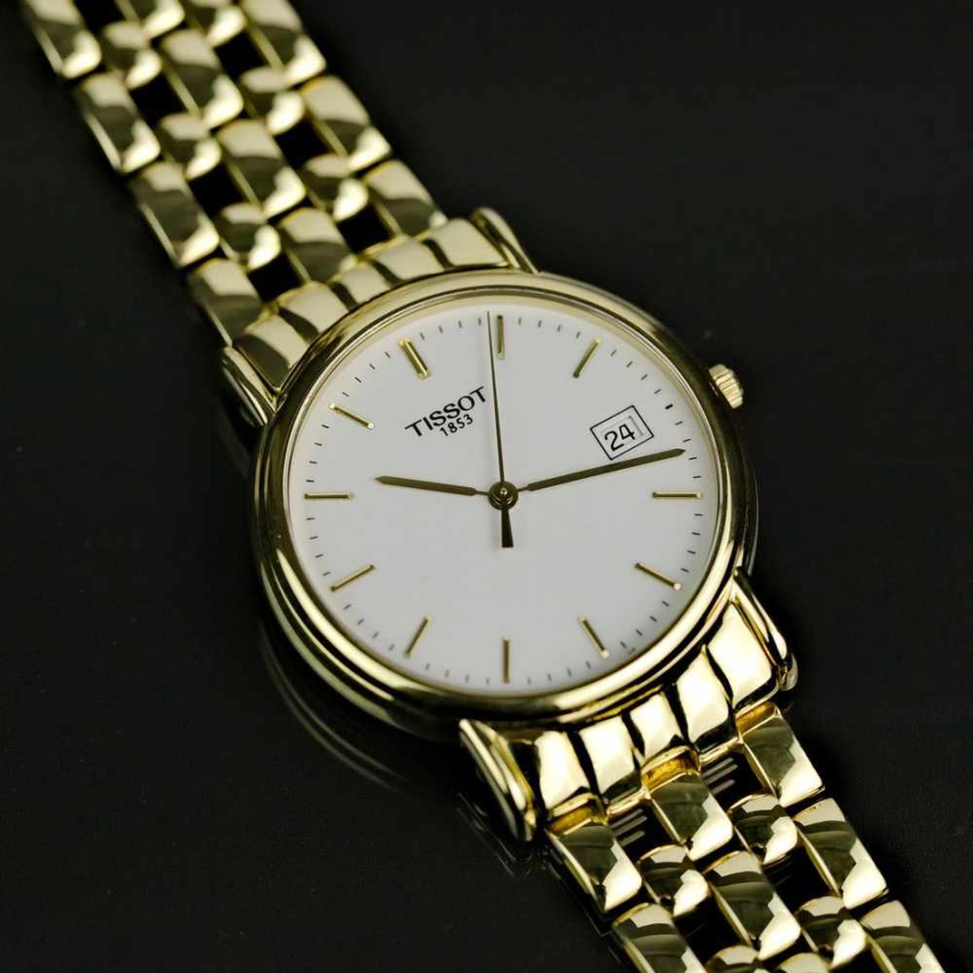 Herrenarmband-Uhr, Tissot / Schweiz, Gelb-Gold 750 / 18 Karat, neuwertig, wohl ungetragen.Punziert