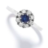 SAPPHIRE AND DIAMOND CLUSTER RING set with a round cut sapphire in a cluster of round cut