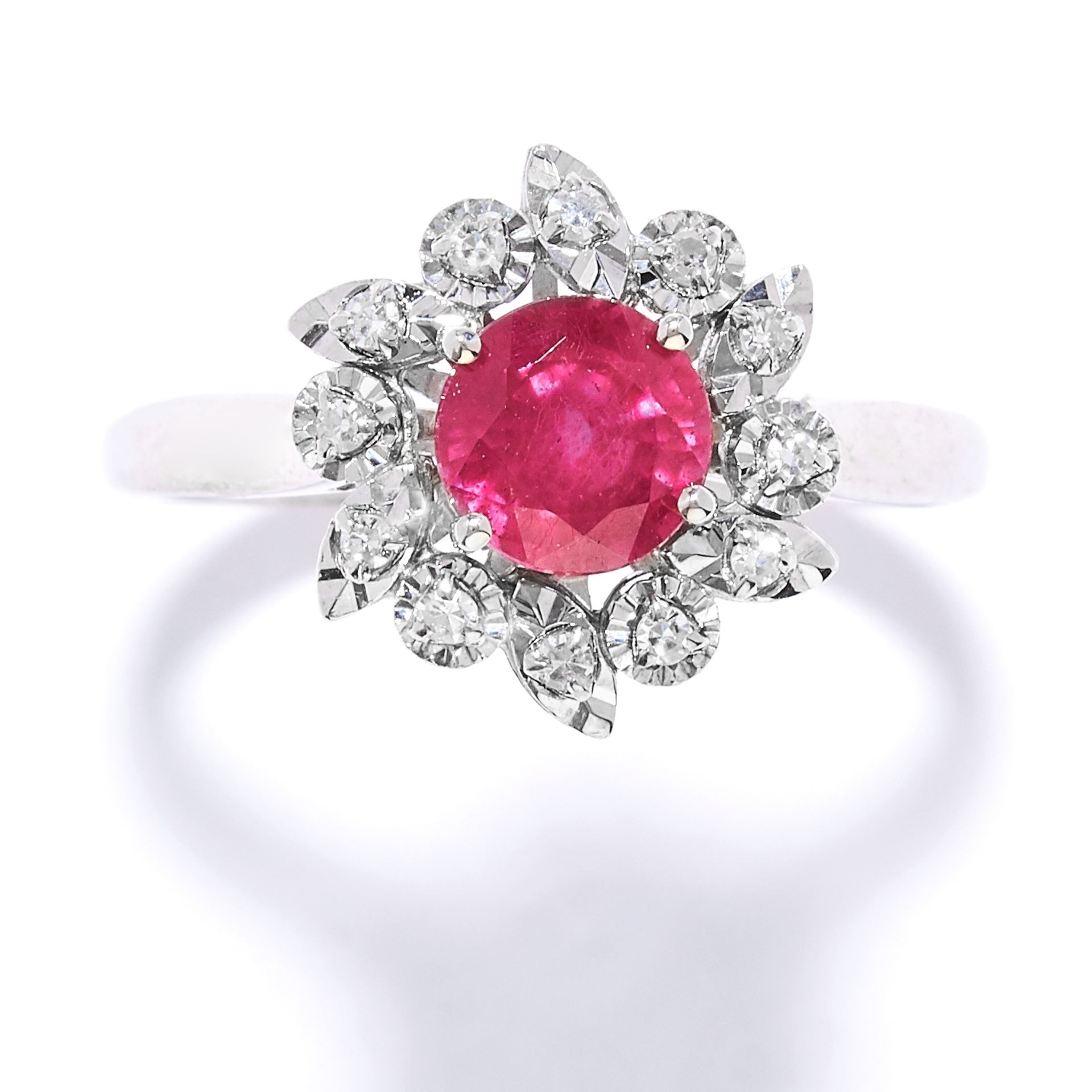 RUBY AND DIAMOND CLUSTER RING set with a round cut ruby in a cluster of round cut diamonds, size N /