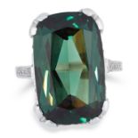 GREEN TOURMALINE AND DIAMOND DRESS RING set with an elongated cushion cut tourmaline of