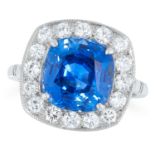 5.82 CARAT SAPPHIRE AND DIAMOND CLUSTER RING comprising of a cushion cut sapphire of approximately