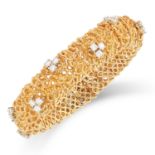 VINTAGE GOLD AND DIAMOND BRACELET, 1970s the textured bracelet set with clusters of round cut