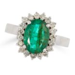 EMERALD AND DIAMOND CLUSTER RING set with an oval cut emerald in a cluster of round cut diamonds, si