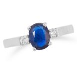 SAPPHIRE AND DIAMOND THREE STONE RING set with an oval cut sapphire between two round cut