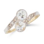 A DIAMOND CROSSOVER RING in yellow gold, set with two old round cut diamonds within a twisted