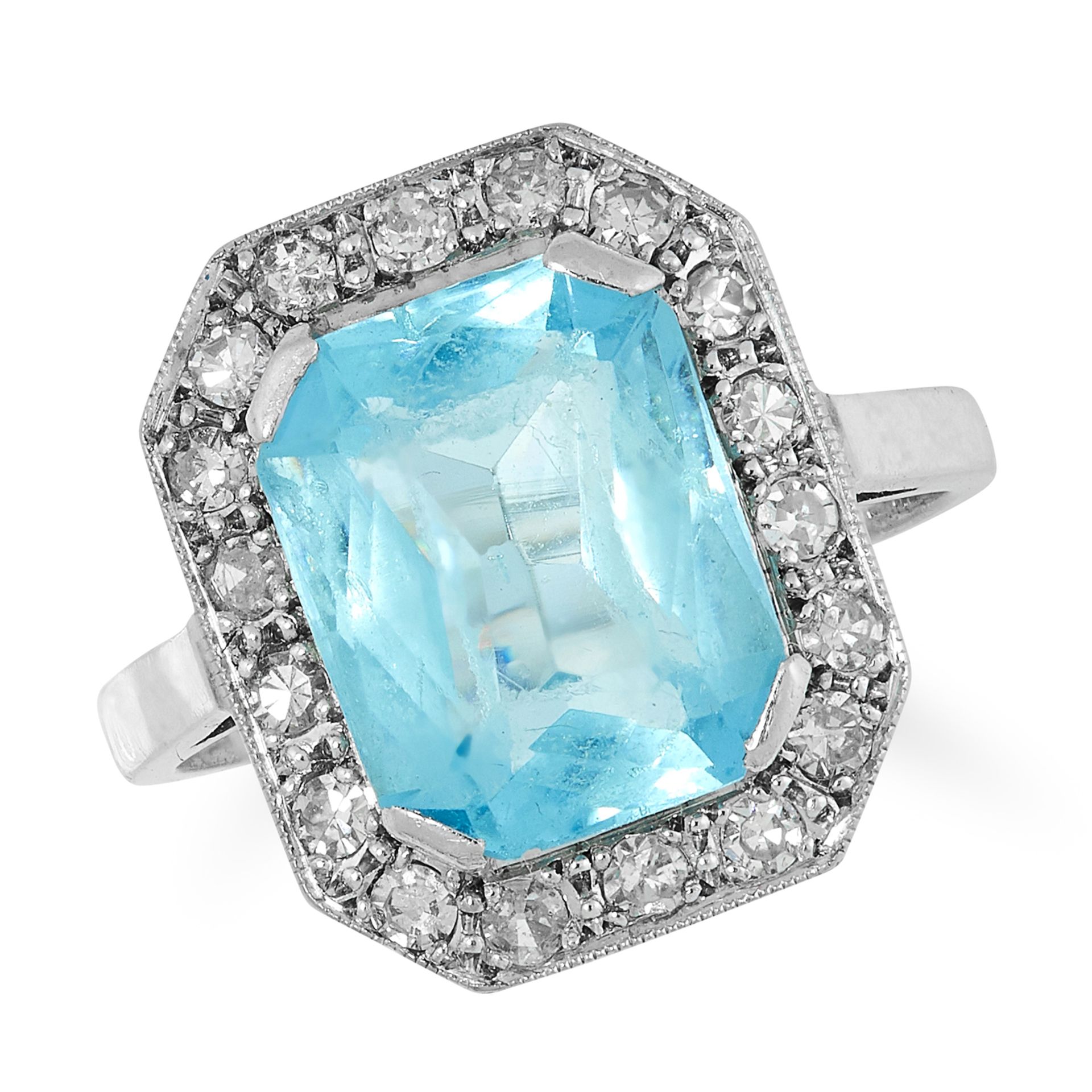 A BLUE TOPAZ AND DIAMOND CLUSTER RING set with a mixed cut blue topaz in a border of round brilliant