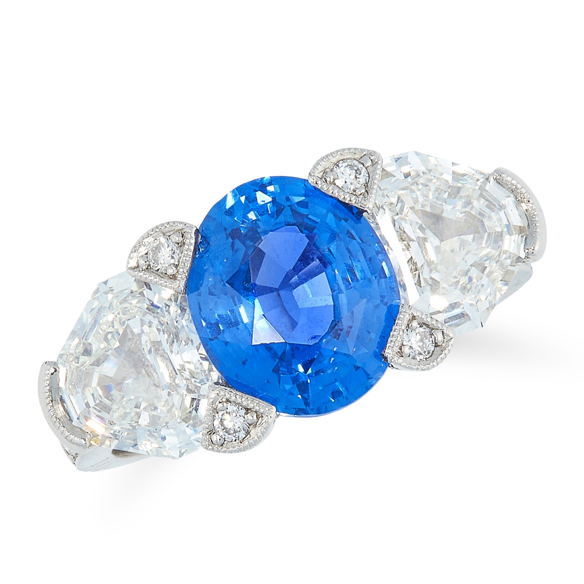 A CEYLON NO HEAT SAPPHIRE AND DIAMOND THREE STONE RING set with an oval cut sapphire of 3.80