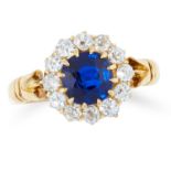 AN ANTIQUE SAPPHIRE AND DIAMOND CLUSTER RING, 1903 in 18ct yellow gold, set with a cushion cut