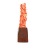 AN ANTIQUE QING DYNASTY CHINESE CARVED CORAL STATUE carved in detail to depict a traditional Chinese