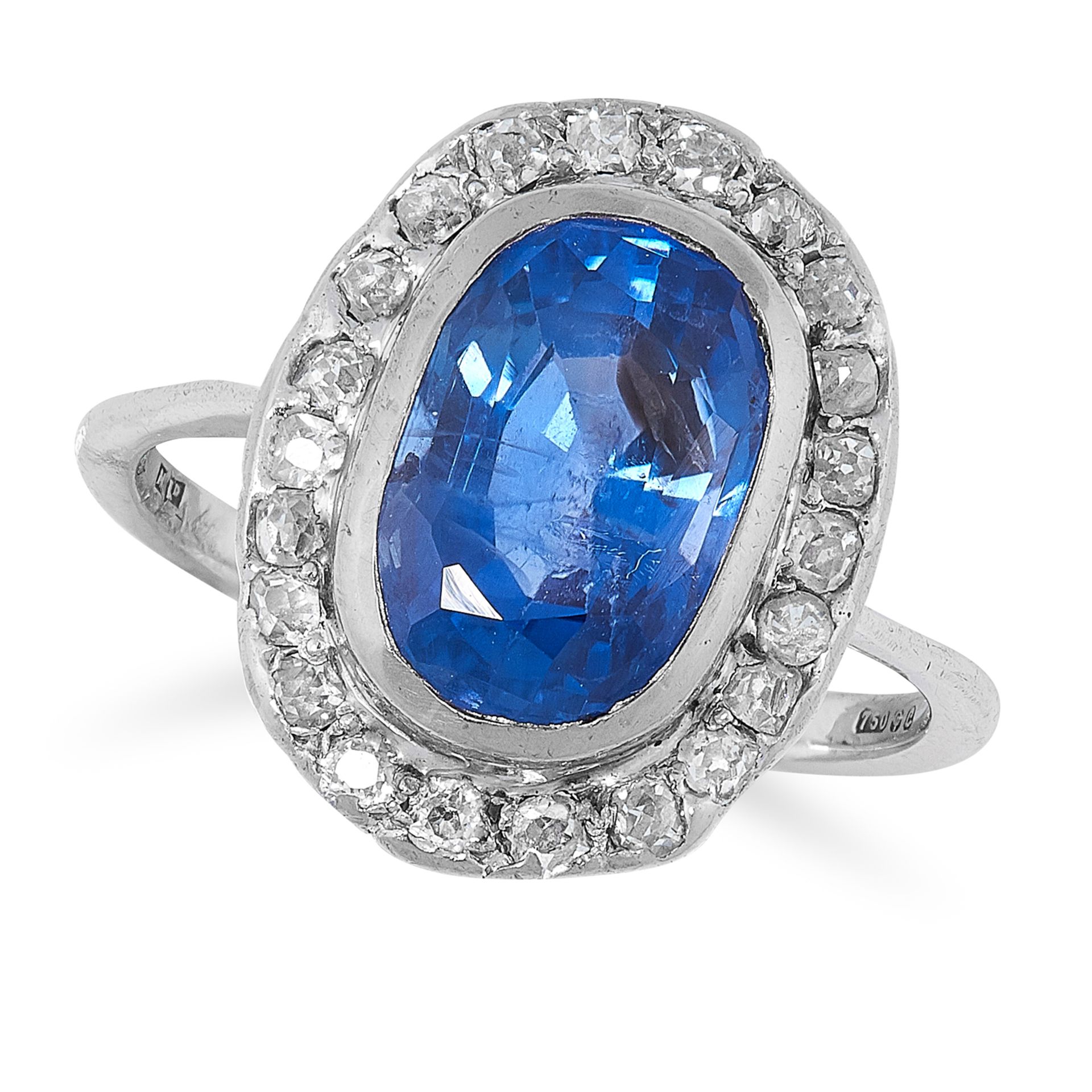 A COLOUR CHANGE SAPPHIRE AND DIAMOND CLUSTER RING in 18ct white gold, set with a central cushion cut