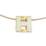 AN ENAMELLED 'H' CUBE PENDANT AND CHAIN, HERMES set with an enamelled 'H' pendant on a wire chain,